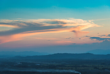 Blue golden sky sunrise dramatic beautiful landscape mountain. Dawn sky gold dusk time cloudscape with sunlight. Dramatic sunset over mountain landscape. Beautiful landscape foggy hills twilight time
