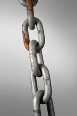 Real steel rusty iron chain isolated on white background.