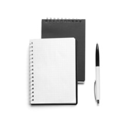 Notebooks and pen on white background, top view