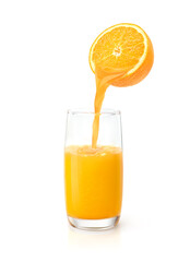 Orange juice pouring from half orange fruit into the glass isolated on white background.