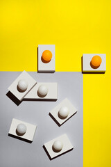 Abstract Still life with white figures and balls on a colored background