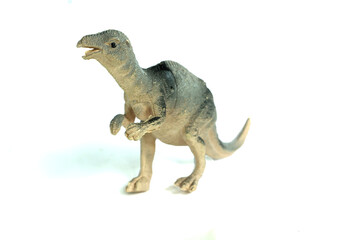 Allosaurus rubber toy dinosaur isolated on white background