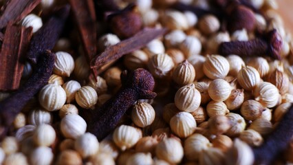 close up of spices cloves, corianders and cinnamon bark. traditional cooking spices. Indonesian traditional spices