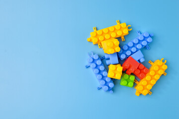 Plastic building blocks isolated on a blue background