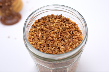 A view of a jar of crushed peanuts.