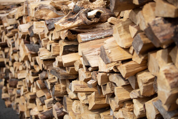 A view of a large pile of chopped firewood for a grilling and smoking.