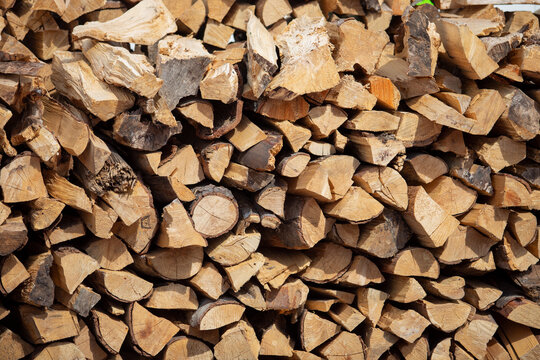A view of a large pile of chopped firewood for a grilling and smoking.