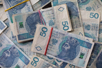Close-up view of a file of fifty-zloty banknotes. Polish national currency.