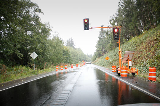 A view of a temporary street signal, seen in a road construction zone.