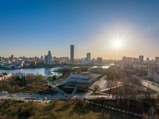 Fototapeta premium Yekaterinburg city and pond aerial panoramic view at early spring or autumn in clear sunset.