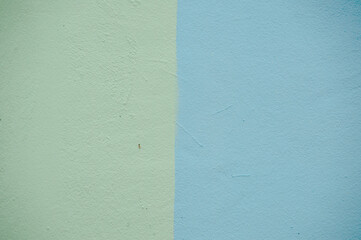 The walls are painted light green and half blue.