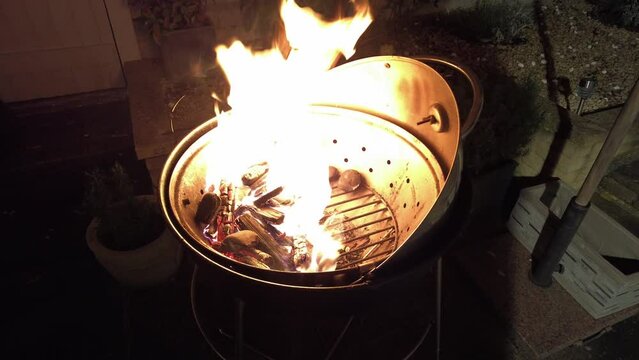 Igniting a BBQ Fire, Handheld Gimble, Wide Shot