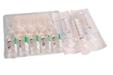  Medical disposable syringes in wrappers. Isolated on white.