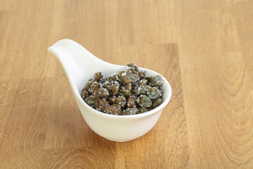Salted marinated capers snack appetiser