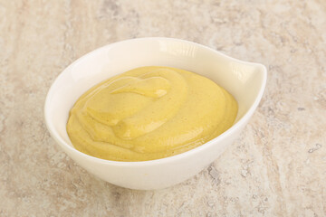 Organic mustard sauce in the bowl