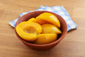 Sweet canned peaches with syrope