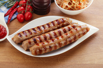 Grilled sausages with cabbage and sauce