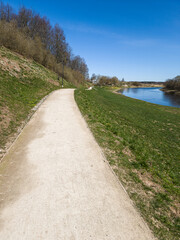 Fototapeta na wymiar Walking trail by the Venta river on a sunny spring day, Skrunda, Latvia.