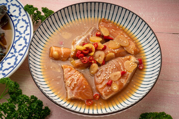 Korean Soy Sauce Pickled Salmon, Fresh raw Pickled Salmon in a mild soy sauce, Ganjang Gejang Korean traditional food.