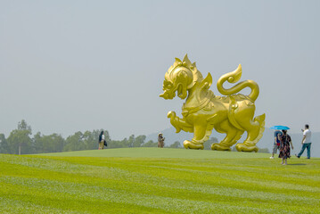 A large lion statue was placed on the lawn.