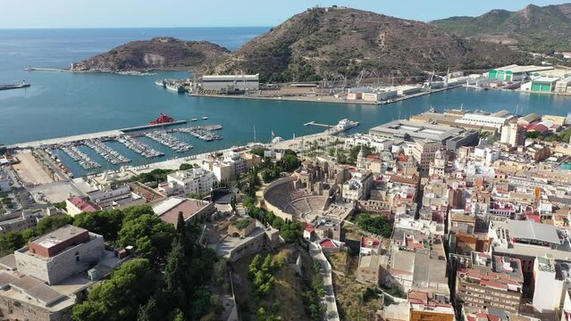 Aerial view of Cartagena port city with buildings and coast line, Autonomous Community of Murcia, southeastern Spain. High quality 4k footage