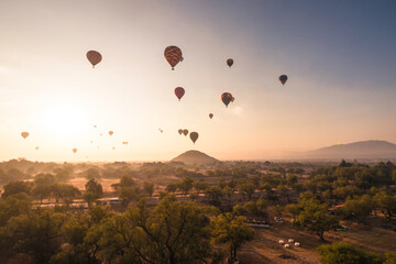 Panoramic shot of the Pyramids of Teotihuacan and trees from a sky balloon in Mexico