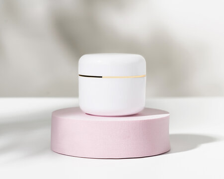 White Cosmetic Bottle On Podium, Ingredients For Skin Care And Treatment Vitamin, Packaging Product For Mockup.