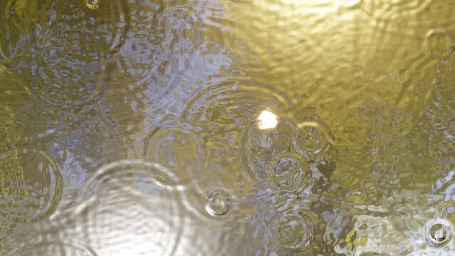 Ripple on water surface by many rain drops and  moon reflected on it.