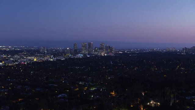 Aerial Backward Beautiful Shot Of Illuminated City At Night - Los Angeles, California