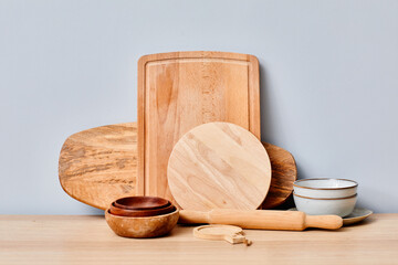Image of wooden cutting boards and bowls on table in kitchen