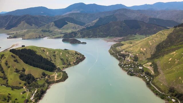 Aerial View Of Green Islands At Calm Waters At Delaware Bay And Cable Bay In New Zealand. - pullback