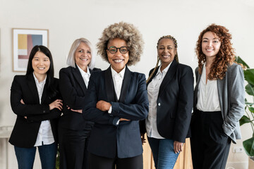 Fototapeta na wymiar group multiracial business women meeting with arms crossed - business concept -