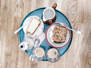 Homemade lemon cake with strawberry jam on top served in grey ceramic plate