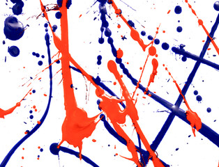 Drops of red and blue paint on a white background.