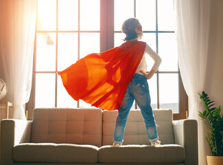 child is playing superhero © Konstantin Yuganov