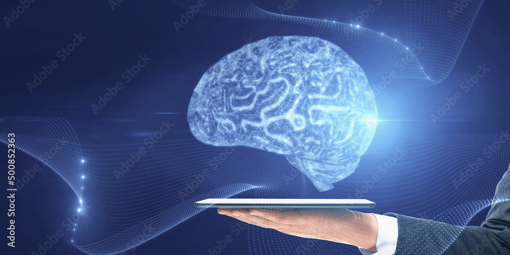 Poster Close up of businessman hand holding tablet with low polygon brain wireframe mesh on blue background. AI and computing concept.