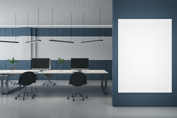 Modern concrete coworking office interior with empty mock up poster on wall, computer monitors on desks and chairs. 3D Rendering.