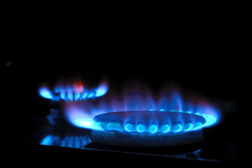 gas burner with burning gas. dark background