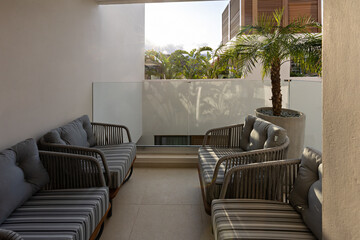 Hotel resort apartment terraces with armchairs and table