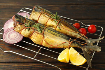 Concept of tasty food with smoked mackerel on wooden table