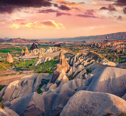 Splendid summer scene of  Cappadocia with balloons on background. Colorful outdoor scene in Red...