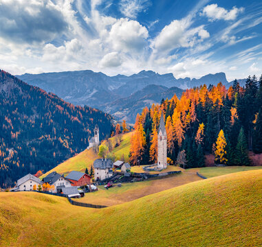 Splendid autumn view of San Genesio and Santa Barbara churches. Gorgeous morning scene of Tolpei village, Province of Bolzano - South Tyrol, Italy, Europe. Beauty of countryside concept background.