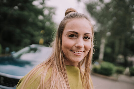 Smiling young woman with blond hair