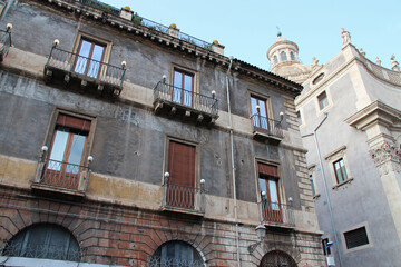 Fototapeta na wymiar ancient palace or flat building and baroque church (Badìa di Sant'Agata) in catania in sicily (italy) 