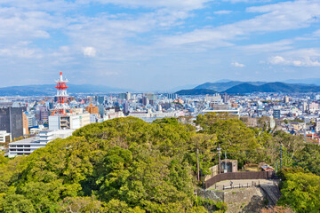 Fototapeta na wymiar Wakayama cityscape, view from rooftop of the Wakayama castle.