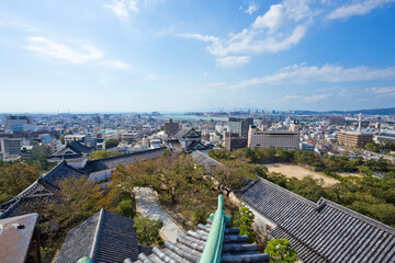 Fototapeta na wymiar Wakayama cityscape, view from rooftop of the Wakayama castle.