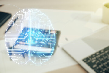 Virtual creative artificial Intelligence hologram with human brain sketch on calculator and laptop background. Multiexposure