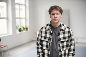 Young man wearing checked shirt