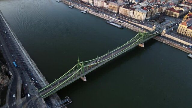 Tram passing across Liberty bridge in Budapest Hungary with Danube river view ,4K aerial topdown drone shot 3