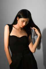 Fashion and beauty concept, Fashion woman with glowing makeup and pose on gray background